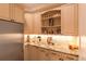 Pantry area with stainless steel refrigerator and plenty of storage at 6302 Charrington Dr, Cherry Hills Village, CO 80111