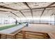 An indoor recreation space featuring a basketball court, sand volleyball court and lounge areas at 6302 Charrington Dr, Cherry Hills Village, CO 80111