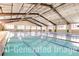 Bright indoor swimming pool with multiple lanes, ideal for swimming laps and water exercise at 6302 Charrington Dr, Cherry Hills Village, CO 80111
