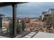 Back porch view of the neighborhood, yard, and a playground set at 8010 Blue River Ave, Littleton, CO 80125