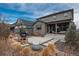 Inviting backyard with patio, grill, and seating area perfect for outdoor entertaining at 8010 Blue River Ave, Littleton, CO 80125