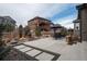 Well-maintained backyard patio with outdoor kitchen, landscaping and an outdoor dining area at 8010 Blue River Ave, Littleton, CO 80125