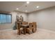 Basement area with a dining set and decor art piece at 8010 Blue River Ave, Littleton, CO 80125