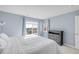 Inviting bedroom with large windows offering scenic views and a modern dresser at 12814 Jasmine St # C, Thornton, CO 80602