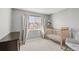 Bedroom featuring neutral walls, a crib, and a dresser at 12814 Jasmine St # C, Thornton, CO 80602