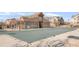 Community pool covered for the winter, showcasing nearby clubhouse and meticulously kept landscaping at 12814 Jasmine St # C, Thornton, CO 80602