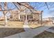 Charming townhome with stone accents, a well-manicured lawn, and a cozy front porch at 12814 Jasmine St # C, Thornton, CO 80602