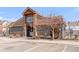 Community clubhouse featuring stylish architecture, outdoor seating, and well-maintained landscaping at 12814 Jasmine St # C, Thornton, CO 80602
