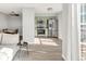 Open concept kitchen with stainless steel appliances and light green cabinets at 12814 Jasmine St # C, Thornton, CO 80602