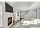 Cozy living room with fireplace, natural light, and comfortable seating at 12814 Jasmine St # C, Thornton, CO 80602