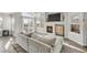 Bright living room showcasing fireplace, sliding doors, and hardwood floors at 12814 Jasmine St # C, Thornton, CO 80602