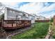 Backyard featuring a spacious deck, well-maintained lawn, and privacy, perfect for outdoor entertaining at 13340 Saint Paul St, Thornton, CO 80241