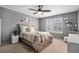 Cozy bedroom featuring a neutral palette, ceiling fan, shuttered windows, and tasteful decor create calming atmosphere at 13340 Saint Paul St, Thornton, CO 80241