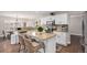 Bright kitchen boasts granite counters, stainless appliances, and island with seating, creating inviting space at 13340 Saint Paul St, Thornton, CO 80241