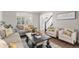 Comfortable living room with hardwood floors, neutral furniture, and lots of natural light for welcoming atmosphere at 13340 Saint Paul St, Thornton, CO 80241