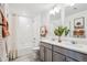 Shared bathroom with double vanity and tub at 948 Andrews Crest Dr, Berthoud, CO 80513