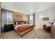 Spacious main bedroom with king-size bed and sitting area at 948 Andrews Crest Dr, Berthoud, CO 80513