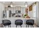 Modern kitchen with gray cabinets and a large island with seating at 948 Andrews Crest Dr, Berthoud, CO 80513