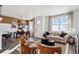 Open concept living and dining area with modern decor at 948 Andrews Crest Dr, Berthoud, CO 80513