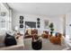 Living room with a comfortable sofa and two armchairs at 948 Andrews Crest Dr, Berthoud, CO 80513