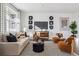 Modern living room with a neutral color palette and stylish decor at 948 Andrews Crest Dr, Berthoud, CO 80513