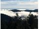 Breathtaking mountain view overlooking the clouds at 33121 Lynx Ln, Evergreen, CO 80439