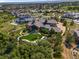 Expansive property with manicured lawns, mature trees, and a luxurious residence at 7767 Dante Dr, Littleton, CO 80125