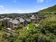 Stunning aerial view of the estate featuring lush landscaping, a well-maintained lawn, and a luxurious residence at 7767 Dante Dr, Littleton, CO 80125