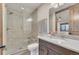 Modern bathroom featuring a frameless glass shower, marble vanity, and contemporary fixtures at 7767 Dante Dr, Littleton, CO 80125