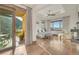 Large main bedroom with tray ceiling, balcony access, and scenic views at 7767 Dante Dr, Littleton, CO 80125