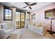 Comfortable bedroom featuring mountain views, light furniture, and lots of natural light at 7767 Dante Dr, Littleton, CO 80125