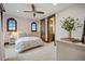 Cozy bedroom with hardwood accents, soft lighting, and decorative decor at 7767 Dante Dr, Littleton, CO 80125