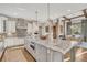 Spacious kitchen with granite island, stainless steel appliances, and adjacent dining area at 7767 Dante Dr, Littleton, CO 80125