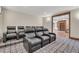 Home theater room with comfortable black leather seating for the ultimate viewing experience at 7767 Dante Dr, Littleton, CO 80125