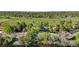 Aerial shot of a neighborhood featuring mature trees, green spaces, and a clear view of the surrounding community at 6700 W 80Th Cir, Arvada, CO 80003