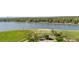 Scenic aerial view of community lake and playground with lush green surroundings at 6700 W 80Th Cir, Arvada, CO 80003