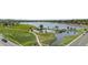 Aerial view of Lake Arbor Park featuring a serene lake, walking paths, and lush green surroundings at 6700 W 80Th Cir, Arvada, CO 80003