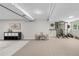 Open basement area showcasing a potential gym space, playroom, and storage solutions at 6700 W 80Th Cir, Arvada, CO 80003