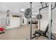 Spacious basement featuring a home gym area with weightlifting equipment and punching bag at 6700 W 80Th Cir, Arvada, CO 80003