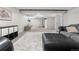 Spacious basement featuring an open layout with carpeted and tiled areas, suitable for gym and playroom at 6700 W 80Th Cir, Arvada, CO 80003
