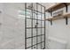 Modern bathroom featuring a glass-enclosed shower with dual shower heads and a tiled surround at 6700 W 80Th Cir, Arvada, CO 80003