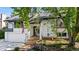 Charming home featuring manicured landscaping, an attached garage, and an inviting entryway with stairs at 6700 W 80Th Cir, Arvada, CO 80003