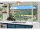 Kitchen with a stainless steel sink and a view of the backyard at 6700 W 80Th Cir, Arvada, CO 80003