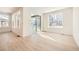 Light-filled dining area with hardwood floors and sliding glass doors to a deck at 565 Twilight St, Erie, CO 80516