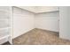 Spacious walk-in closet with shelving and carpeting at 565 Twilight St, Erie, CO 80516