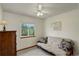 Bedroom with a neutral-toned futon and a window view of the green exterior at 1825 Keota Ln, Superior, CO 80027