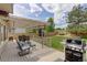 Outdoor deck with furniture, a grill, and a view of the grassy backyard and blue skies at 1825 Keota Ln, Superior, CO 80027