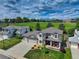 Inviting two-story home with a well-manicured lawn and colorful flowerbeds, set against a scenic backdrop at 1825 Keota Ln, Superior, CO 80027