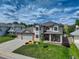 Beautiful two-story home with a well-kept lawn and charming front porch, complete with comfortable seating at 1825 Keota Ln, Superior, CO 80027