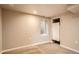 Unfinished basement area featuring a window for natural light at 4804 N Raleigh St, Denver, CO 80212